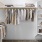 a closet with clothes on hangers