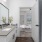 a bathroom with a sink and a mirror and a tub
