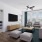 living room with couch and chairs and a tv