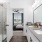 a bathroom with a sink and glass shower and a mirror and a tub