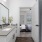 a bathroom with a sink and a mirror and a tub