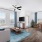 a living room and dining table with many windows