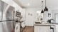 a kitchen with white cabinets