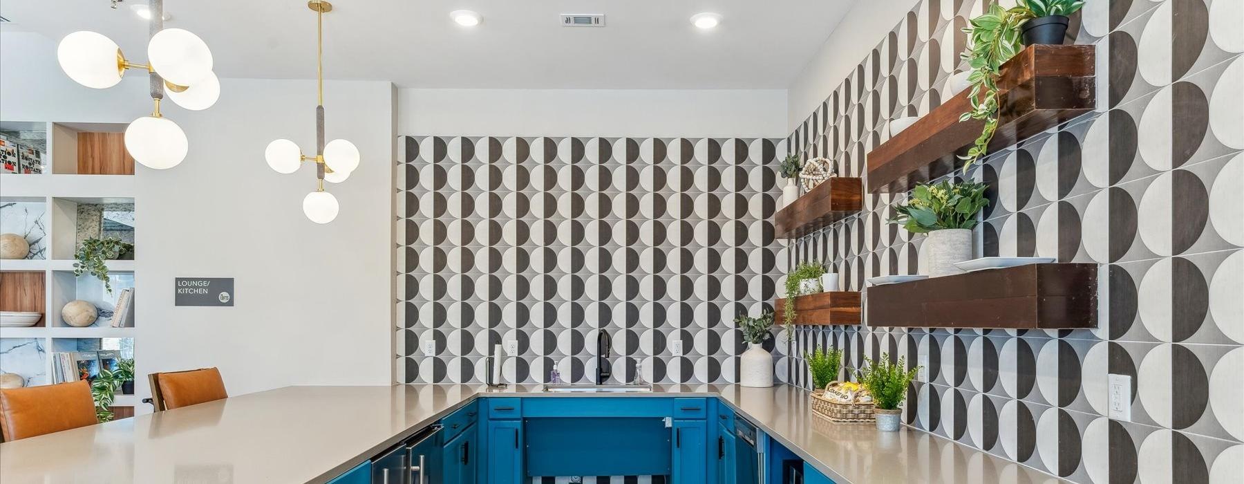 a kitchen with blue cabinets