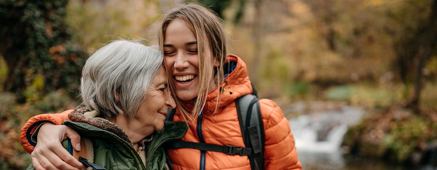 a family hugging and hiking